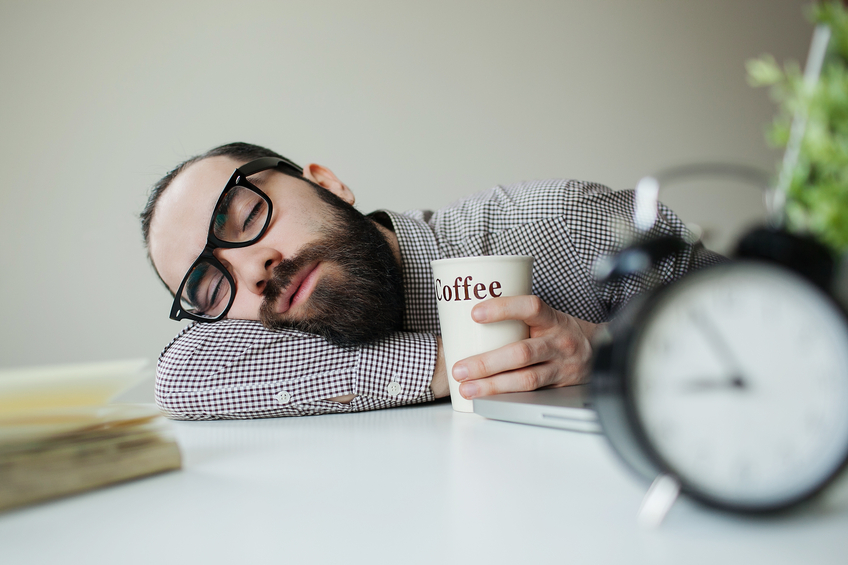 Man Sleeps on Desk